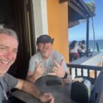 Two men happy on the beach