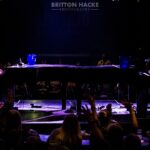 Two men piano dueling on stage