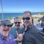 3 men having fun beach background